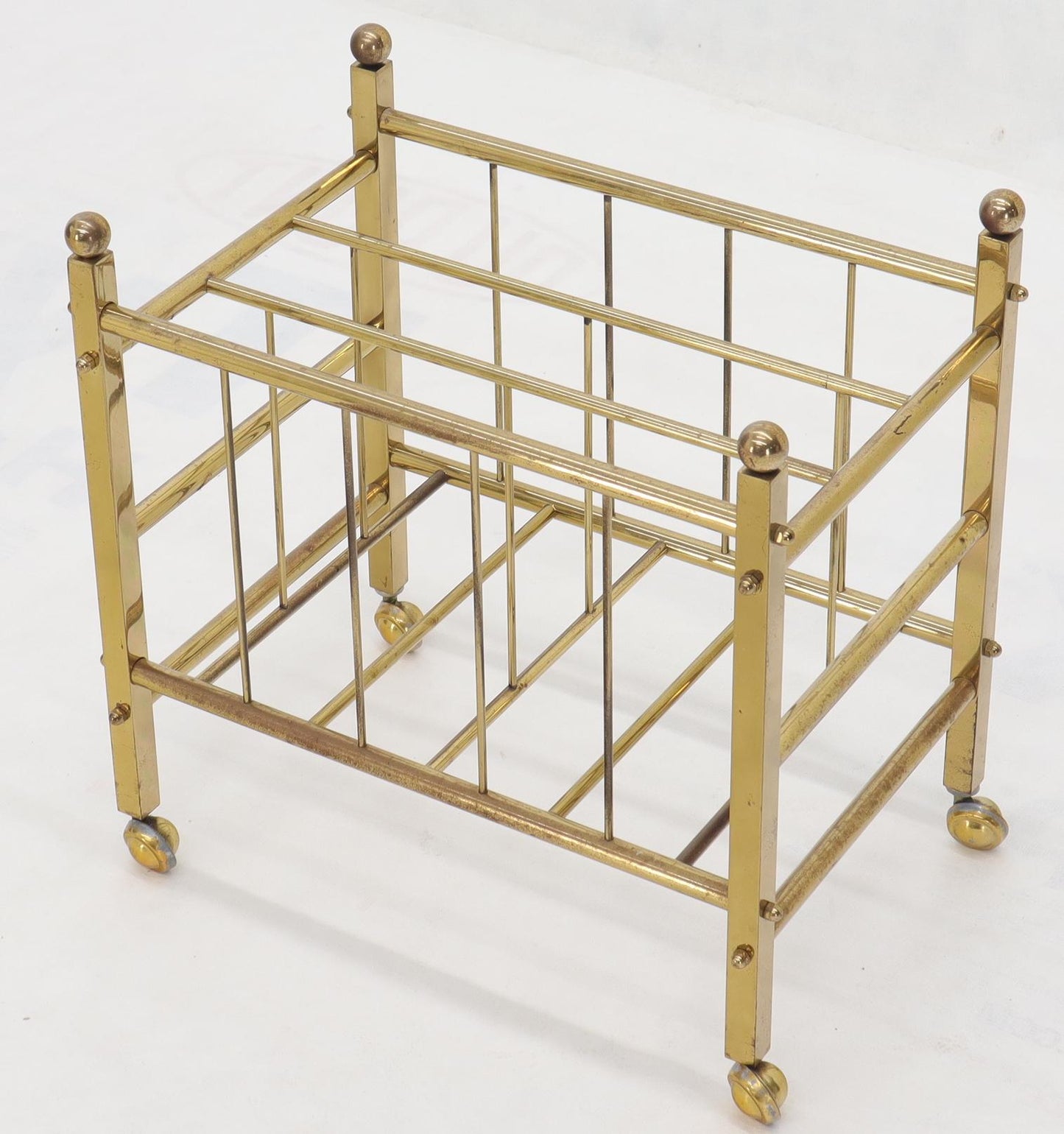 Pair of Mid-Century Modern Polished Brass Magazine Racks on Metal Casters