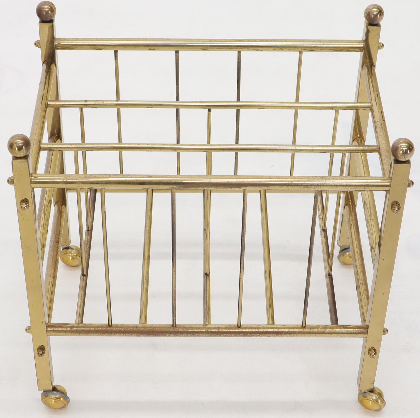 Pair of Mid-Century Modern Polished Brass Magazine Racks on Metal Casters