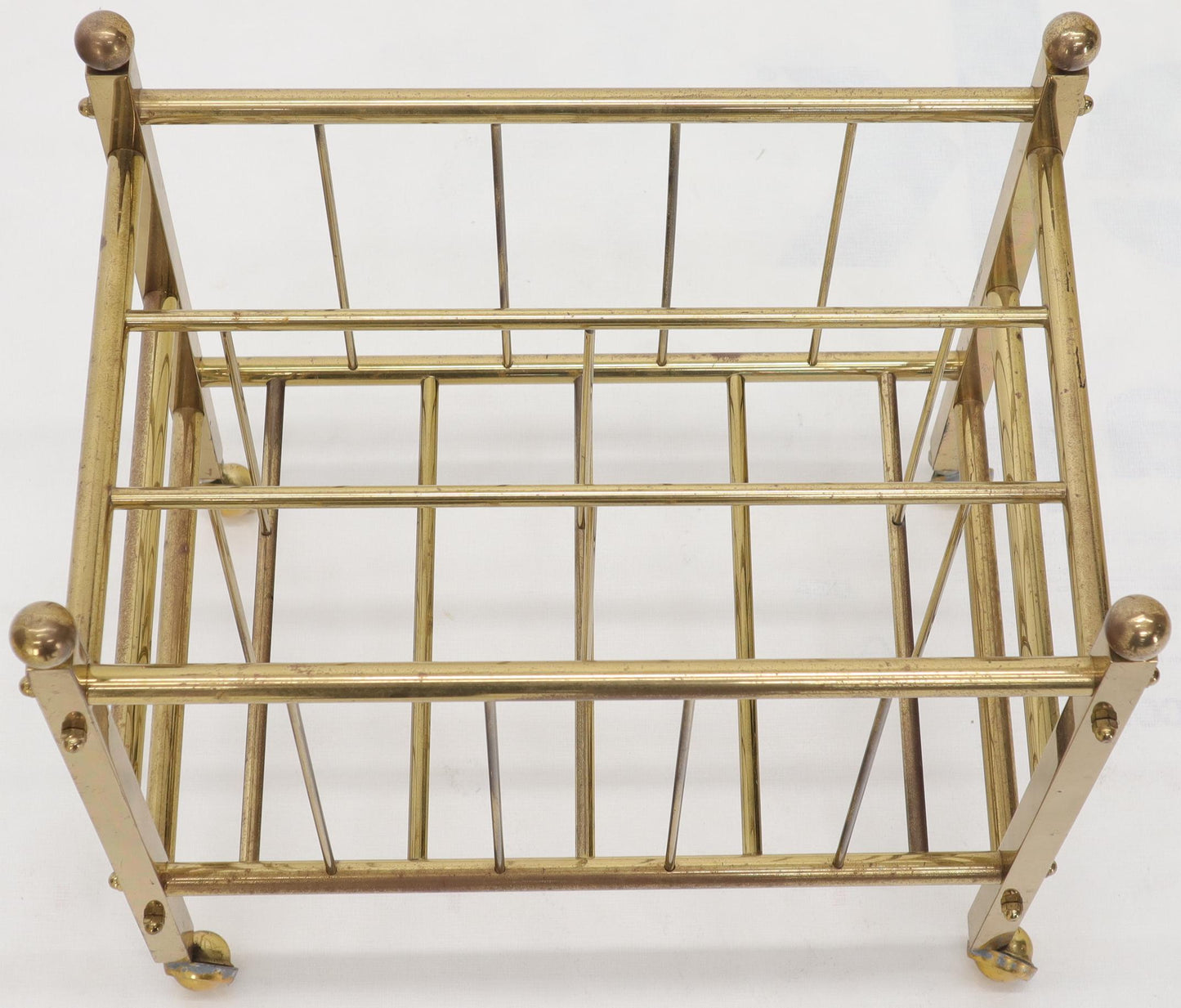 Pair of Mid-Century Modern Polished Brass Magazine Racks on Metal Casters